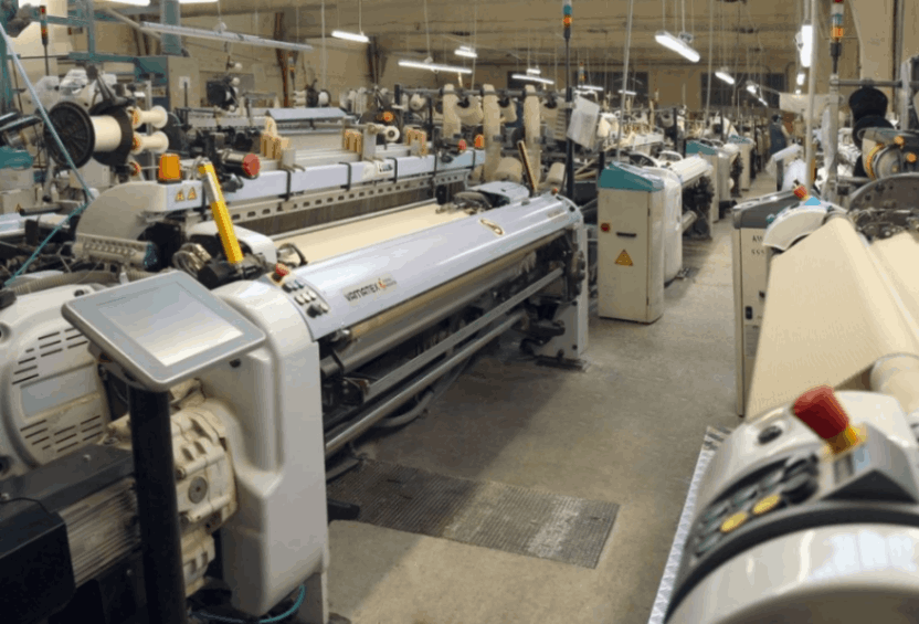Industrial fabric knitting machine used for textile production at PT Mayakawa Sejahtera Indonesia