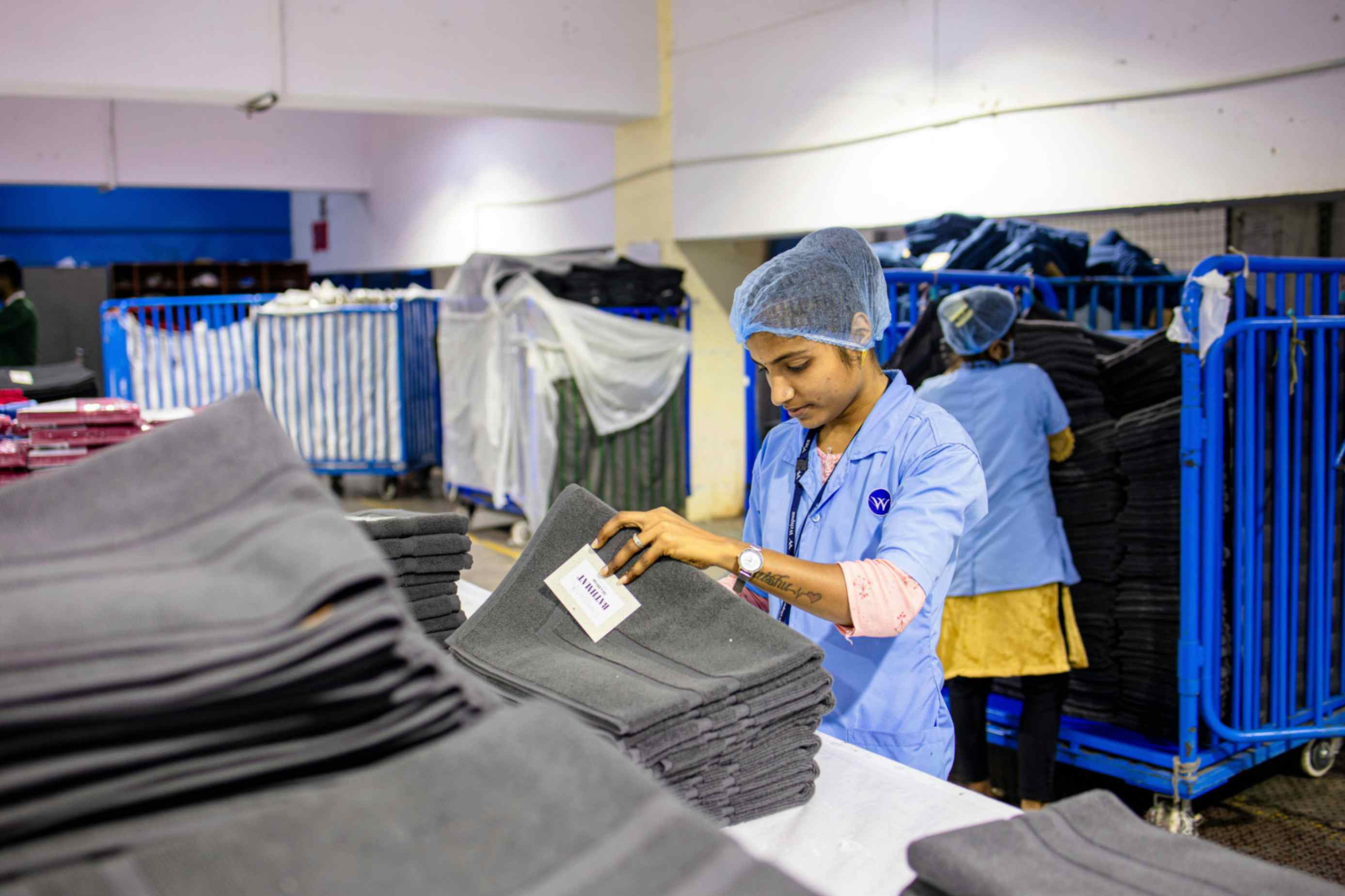 Indonesian textile workers operating garment production machines at PT Mayakawa