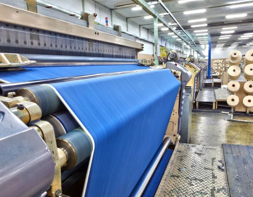 Industrial fabric knitting machine used for textile production at PT Mayakawa Sejahtera Indonesia