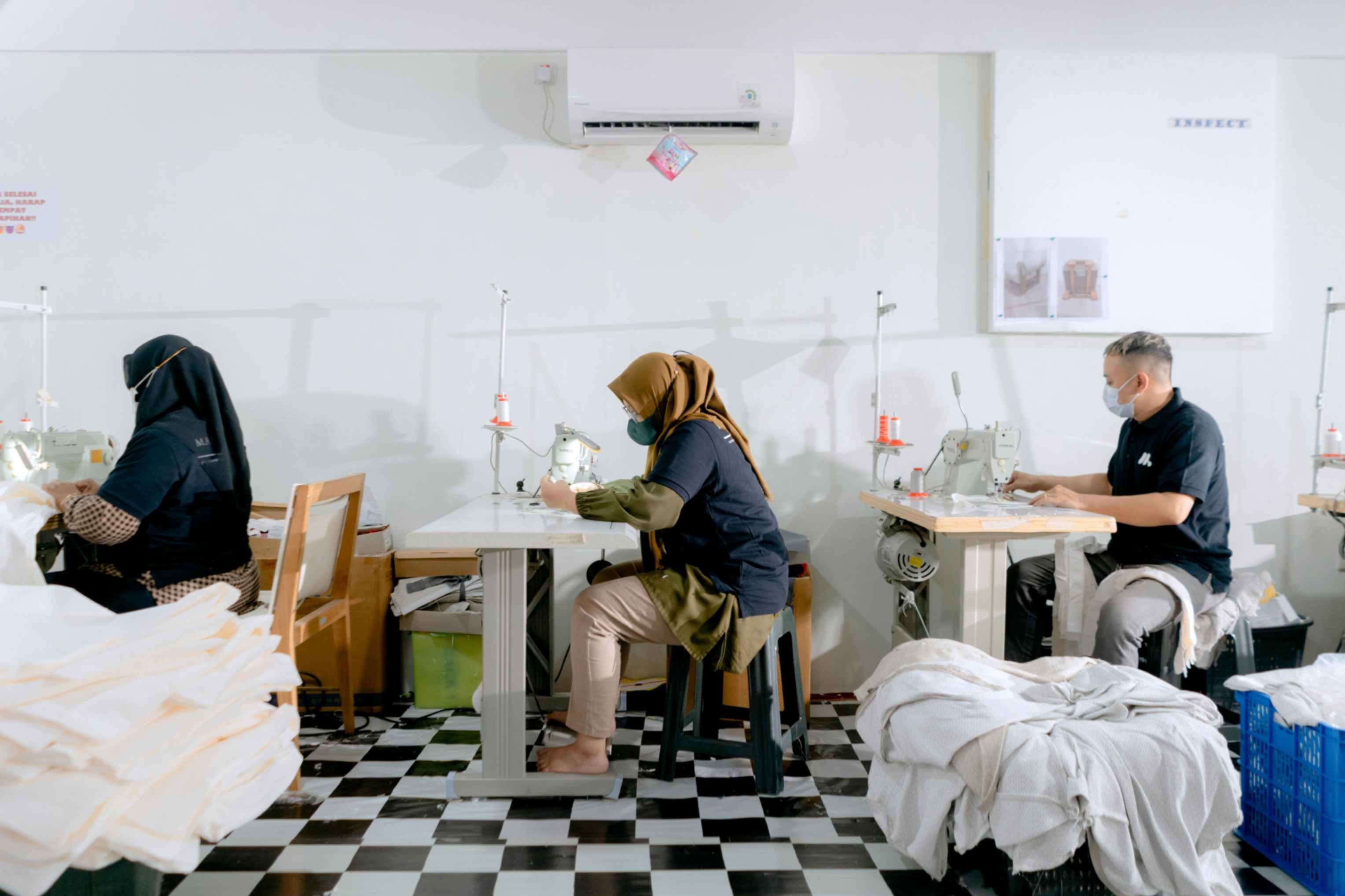 Factory workers producing high-quality fabrics at PT Mayakawa Sejahtera in Indonesia